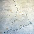 foundation heaving cracks in a slab floor in Bowie