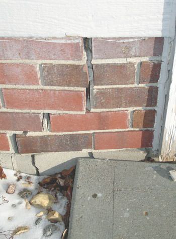Severe street creep damage to a garage wall outside a Pocomoke City home