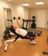 a basement gym and workout room with a wood laminate flooring, installed in Bowie, MD
